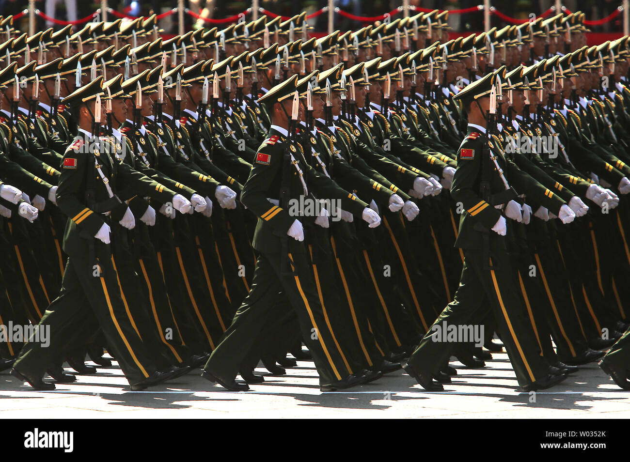 Over 12,000 soldiers and hundreds of tanks, ballistic missile launchers, amphibious assault vehicles, drones, fighter jets, helicopters and other military equipment participate in a massive parade marking the 70th anniversary of victory over Japan and the end of World War II in Beijing on September 3, 2015. Presiding over the extravaganza, President Xi Jinping, China's most powerful leader in decades, said that China would remain committed to 'the path of peaceful development' and unexpectedly vowed to cut 300,000 troops from its 2.3-million strong military -  the world's largest. Photo by Ste Stock Photo