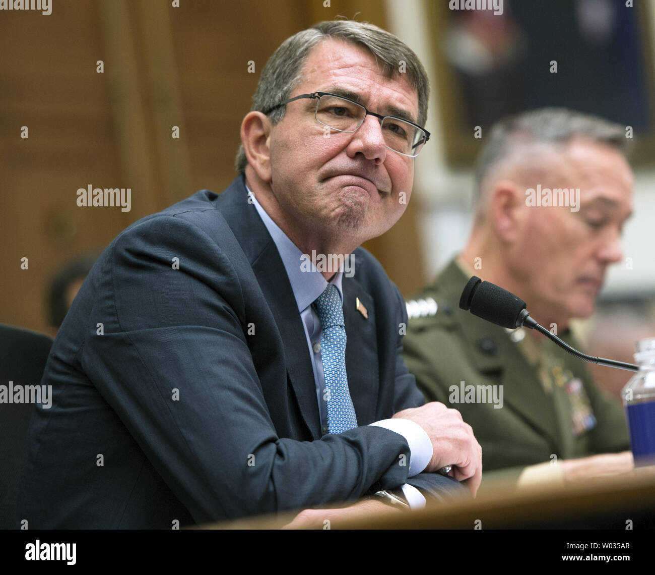Secretary of Defense Ashton Carter (L) and  Chairman of the Joint Chiefs of Staff General Joseph F. Dunford, Jr., USMC, testify during a House Armed Services Committee hearing on the U.S. Strategy for Syria and Iraq and its implications for the region, on Capitol Hill in Washington, D.C. on December 1, 2015. Photo by Kevin Dietsch/UPI. Stock Photo