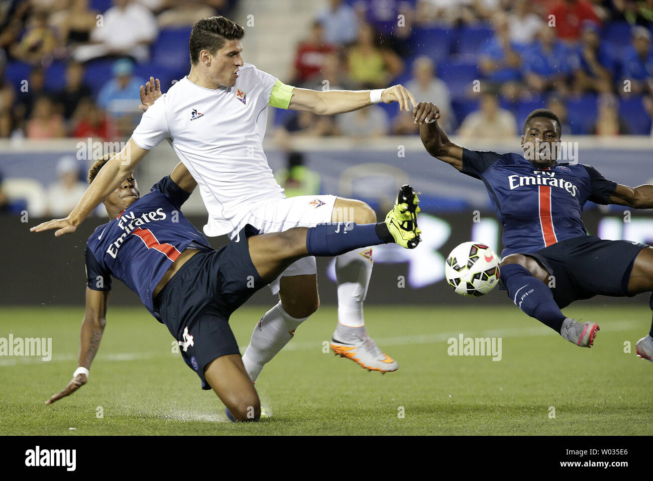 Paris Saint-Germain Blaise Matuidi and Serge Aurier surround ACF Fiorentina Mario Gomez in the first half at the 2015 International Champions Cup North America at Red Bull Arena in Harrison, NJ on July 21, 2015. 2015 begins the International Champions Cup's global expansion, with the tournament kicking off three team editions in both Australia and in China. Photo by John Angelillo/UPI Stock Photo