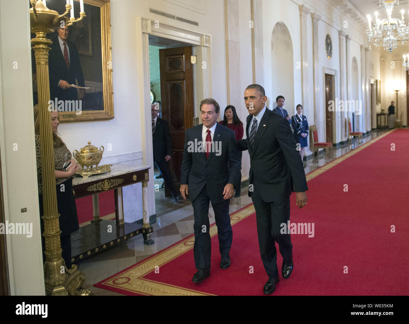 President Barack Obama R Walks With Nick Saban Head