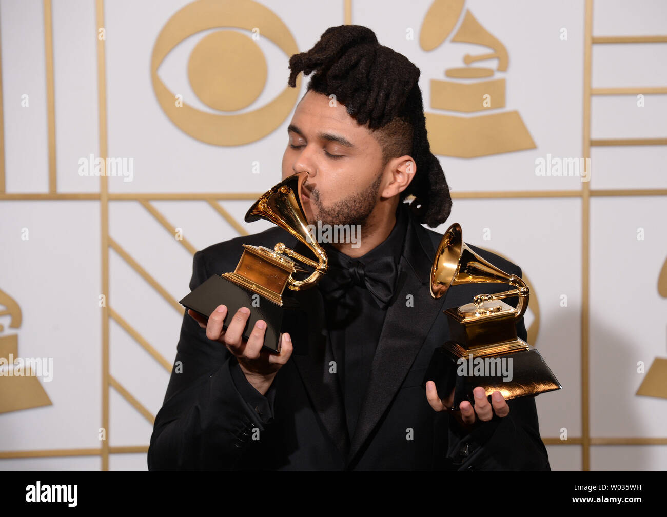 The Weeknd, winner of the Best R&B Performance award for 'Earned It,' and Best Urban Contemporary Album award for 'Beauty Behind The Madness,' appears backstage with his awards during the 58th annual Grammy Awards held at Staples Center in Los Angeles on February 15, 2016. Photo by Phil McCarten/UPI Stock Photo