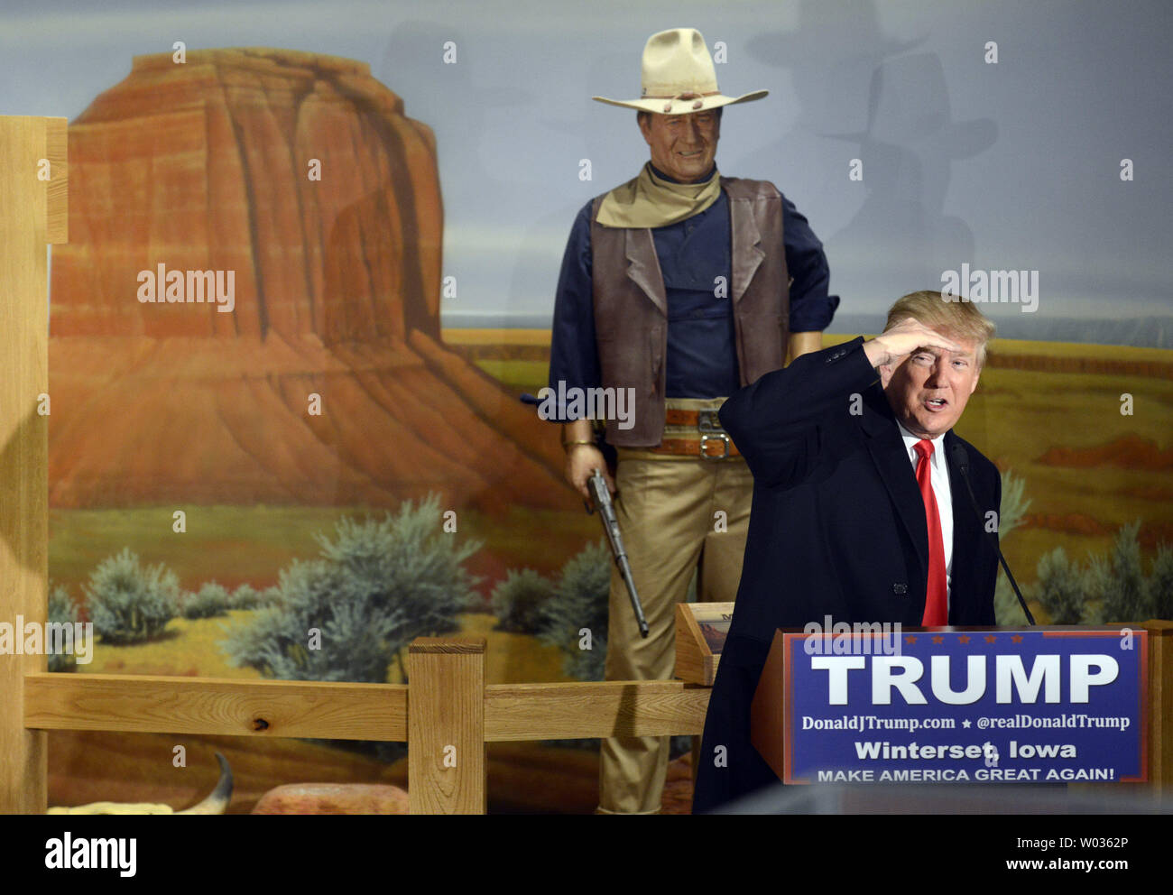 Real estate mogul Donald J. Trump, 2016 Republican presidential candidate, shields his eyes as accepts questions at the John Wayne Birthplace Museum, after Wayne's daughter Aissa endorsed his campaign, January 19, 2016, in Winterset, Iowa. Trump is running against a large field of GOP candidates including Texas Sen. Ted Cruz, Florida Sen. Marco Rubio and retired neurosurgeon Ben Carson, ahead of Iowa's first-in-the-nation caucuses February 1. Photo by Mike Theiler/UPI Stock Photo
