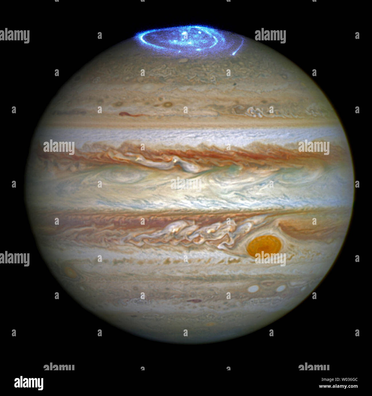 This image, released on June 30, 2016, shows a series of vivid auroras in Jupiter's atmosphere. Astronomers are using NASA's Hubble Space Telescope to study auroras stunning light shows in a planet's atmosphere on the poles of the largest planet in the solar system, Jupiter. The auroras were photographed during a series of Hubble Space Telescope Imaging Spectrograph far-ultraviolet-light observations taking place as NASA's Juno spacecraft approaches and enters into orbit around Jupiter. NASA/UPI Stock Photo