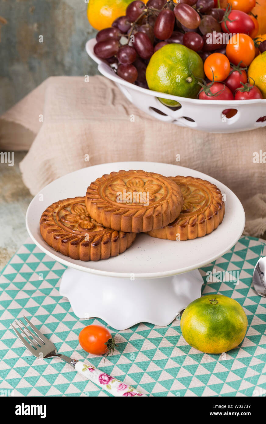 Moon cakes and fruit on the table Stock Photo