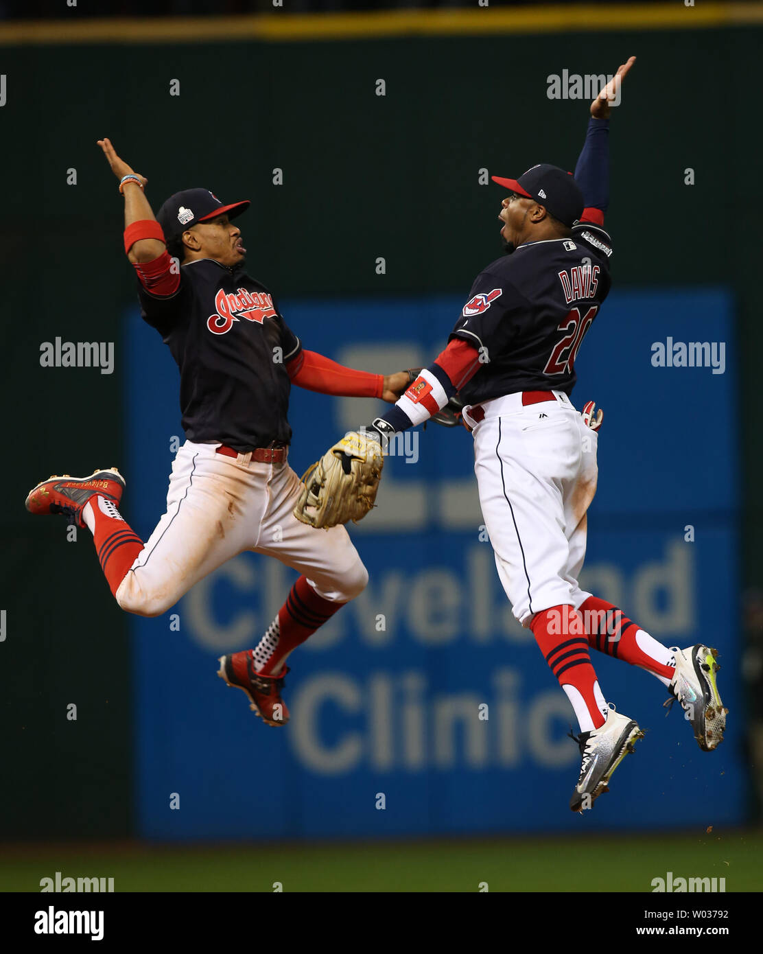 Cleveland Indians Francisco Lindor (L) and Rajai Davis leap to celebrate  winning game 1 of the World Series against the Chicago Cubs at Progressive  Field in Cleveland, Ohio, on October 25, 2016.