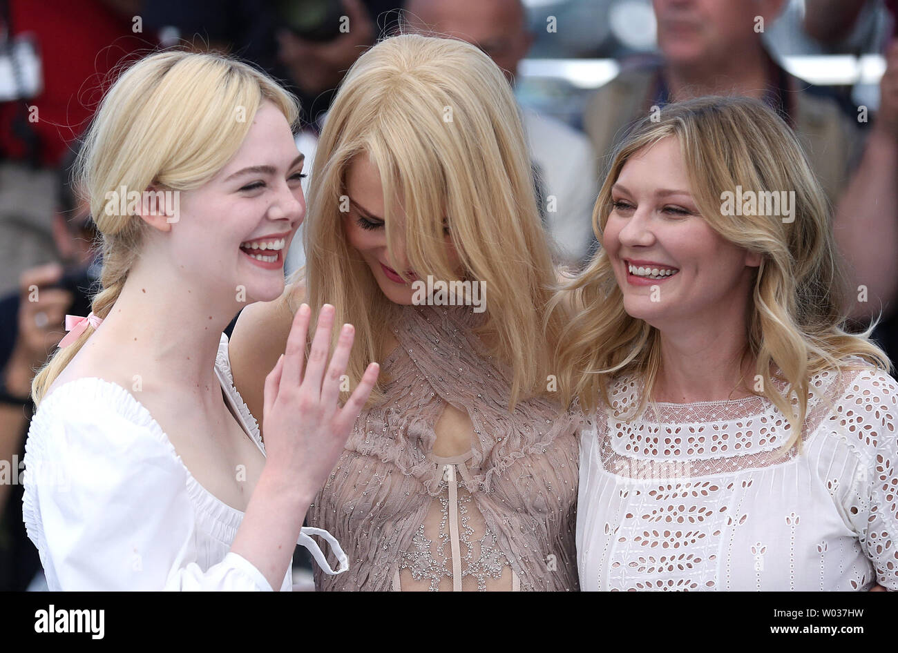 Elle Fanning (L), Nicole Kidman (C) and Kirsten Dunst arrive at a photocall  for the film "The Beguiled" during the 70th annual Cannes International  Film Festival in Cannes, France on May 24,