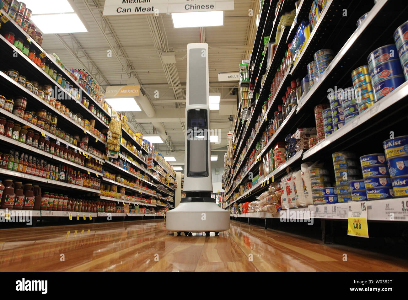 Tally the robot makes his way down an isle, checking the inventory at the Schnucks Supermarket in Richmond Heights, Missouri on August 7, 2017. The 30-pound robot is equipped with sensors to help it navigate through the store, detecting product that is not fully stocked and avoiding customer carts. That data is sent to store management so changes can be made. Tally will be tested over six weeks.   Photo by Bill Greenblatt/UPI Stock Photo