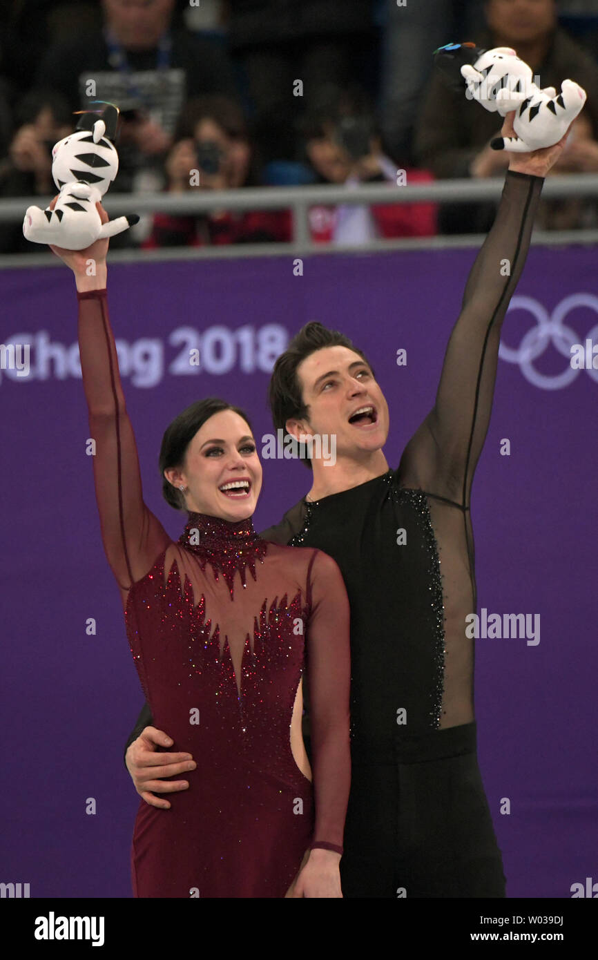 Tessa Virtue and Scott Moir of Canada celebrate their gold medal win in(00)