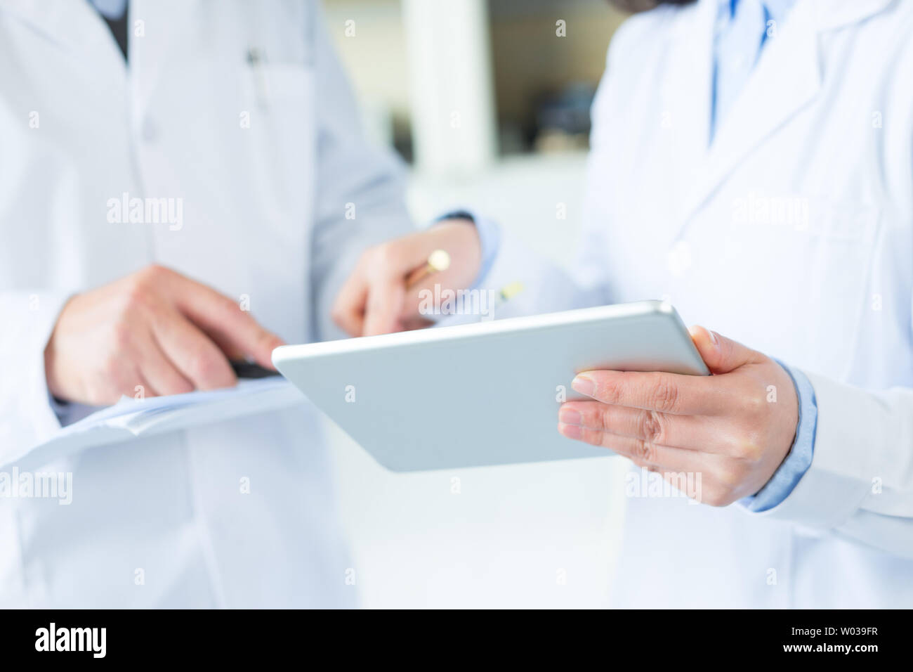 people doing chemical experiment in modern lab Stock Photo