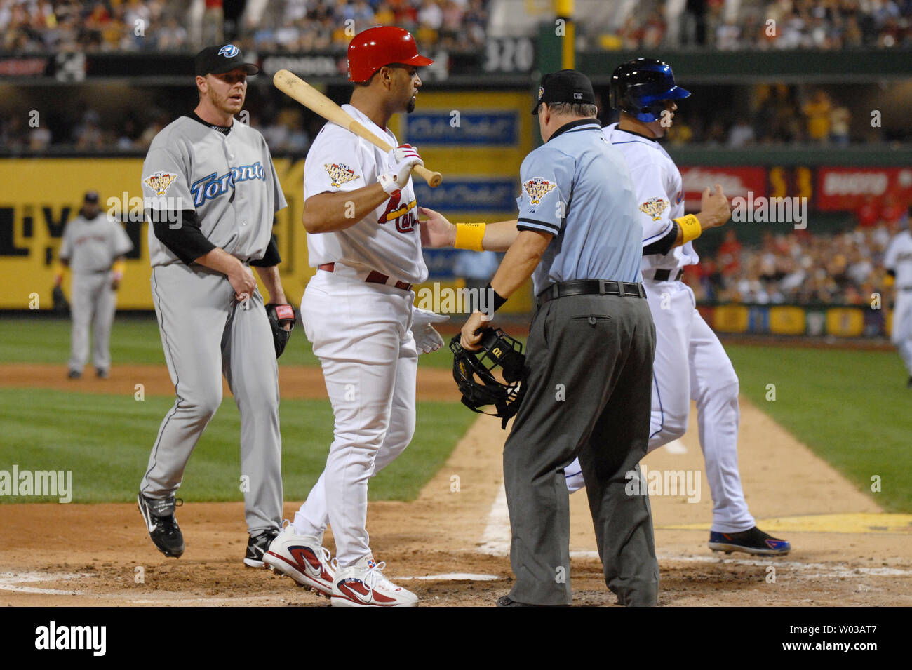 American League Pitcher Roy Halladay Watches As National League Carlos Beltran Scores On A Wild Pitch In The Third Inning As Plate Umpire Jerry Crawford Takes A Quick Glance As He Chats American League Pitcher Roy Halladay Watches As National League Carlos Beltran Scores On A Wild Pitch In The Third Inning As Plate Umpire Jerry Crawford Takes A Quick Glance As He Chats