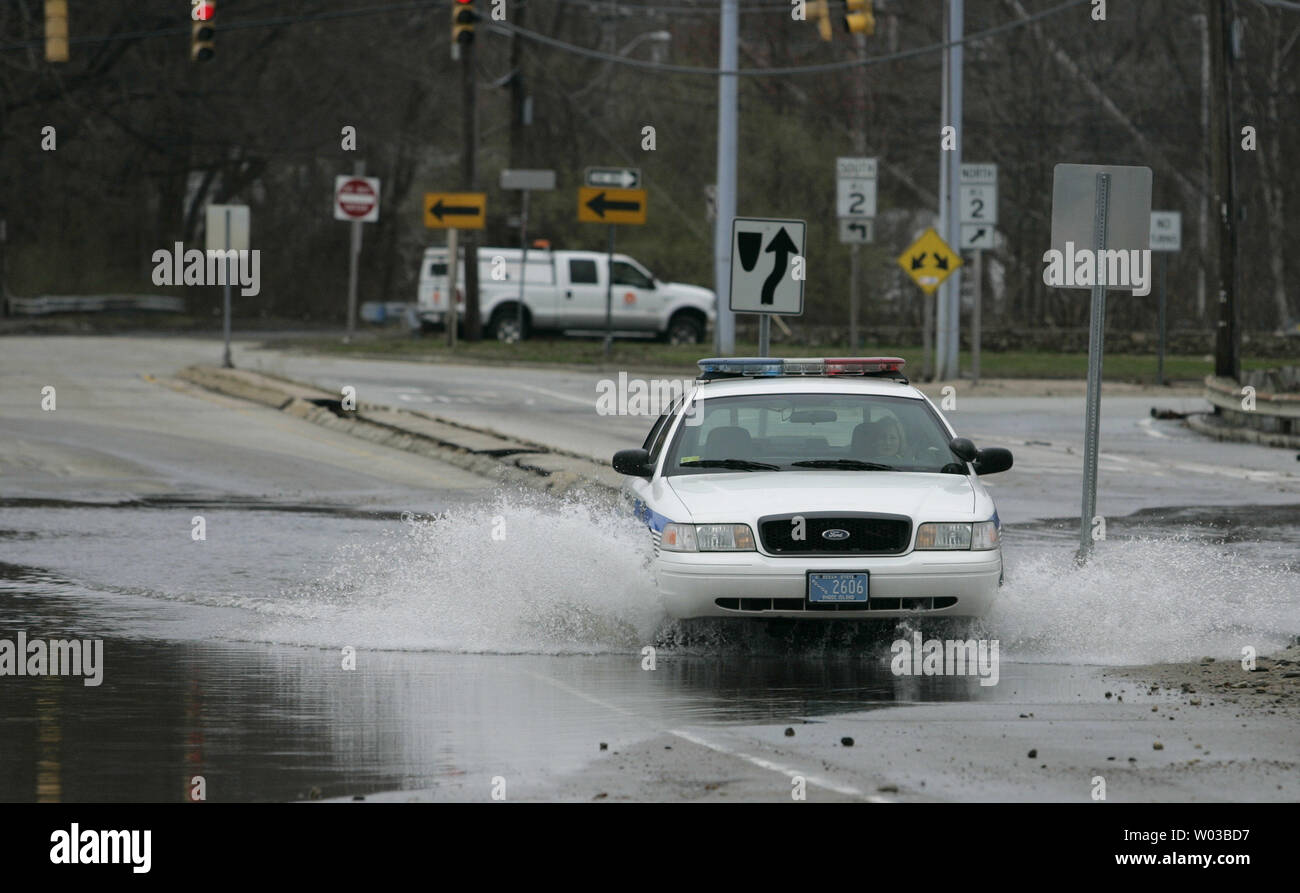 A member of the Warwick, Rhode Island police drives a police cruiser