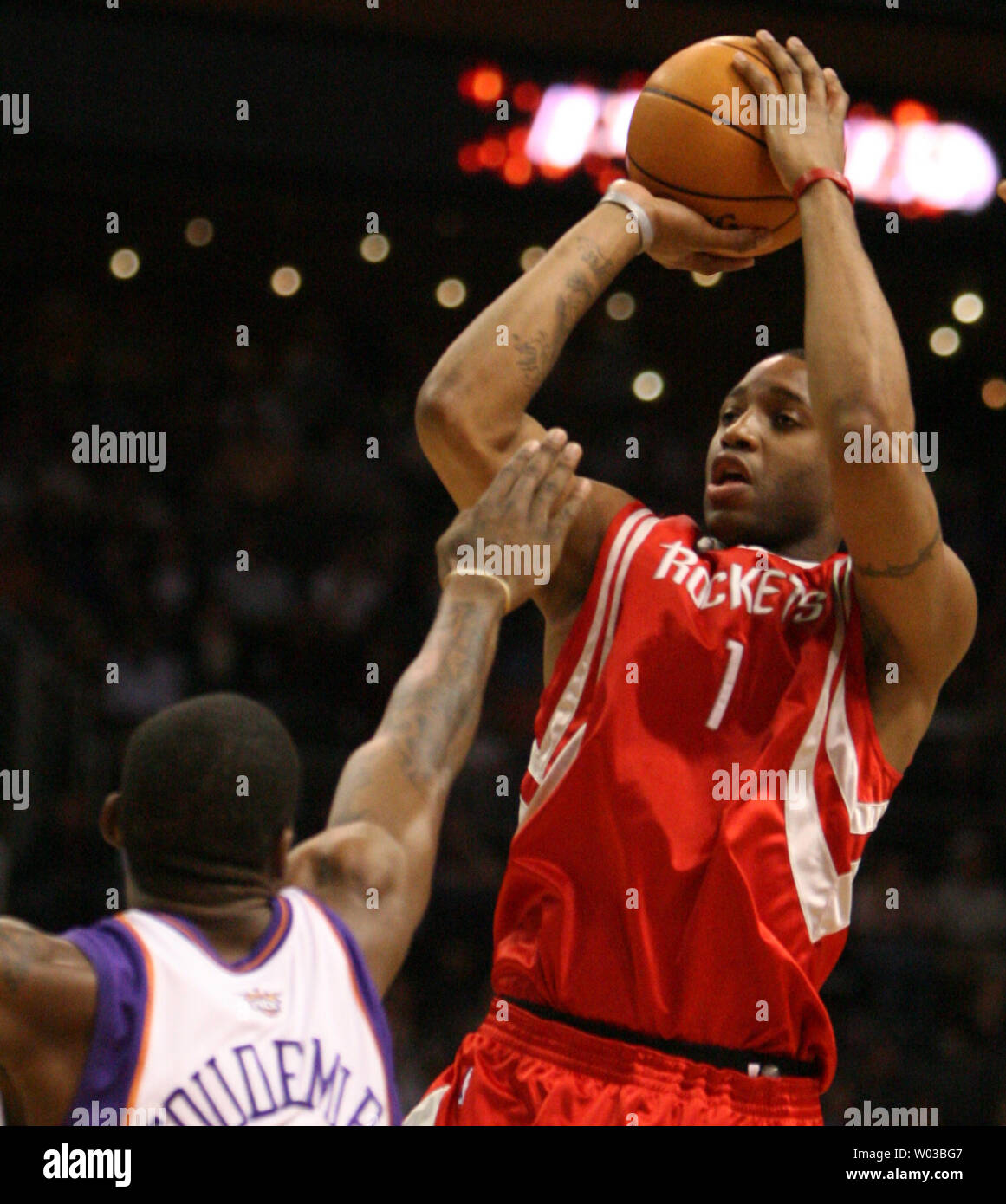 Houston Rockets Guard Tracy McGrady 1 Takes A Shot Over The Houston Rockets Guard Tracy McGrady 1 Takes A Shot Over The
