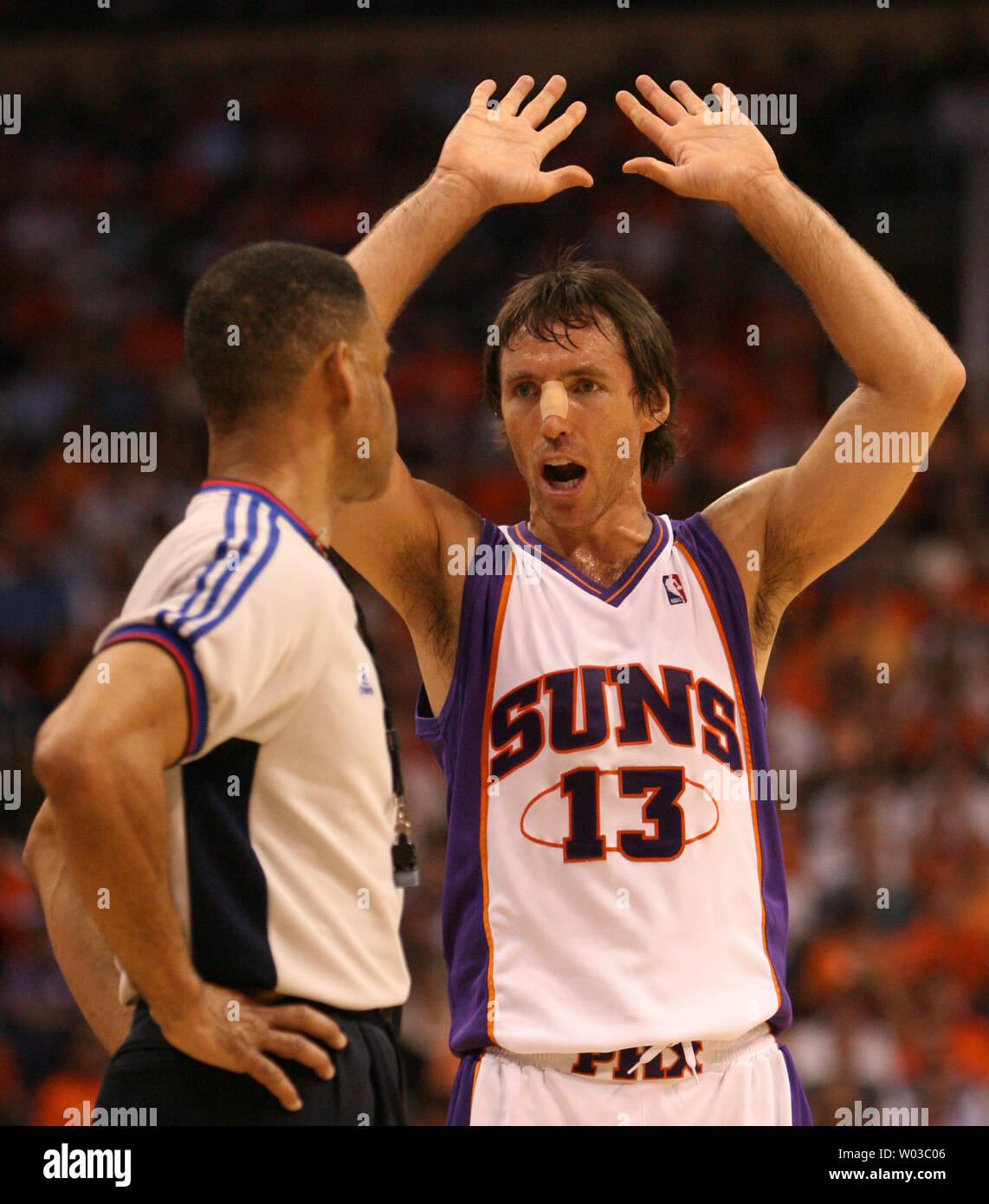 Phoenix Suns guard Steve Nash (13) pleads his case to NBA official