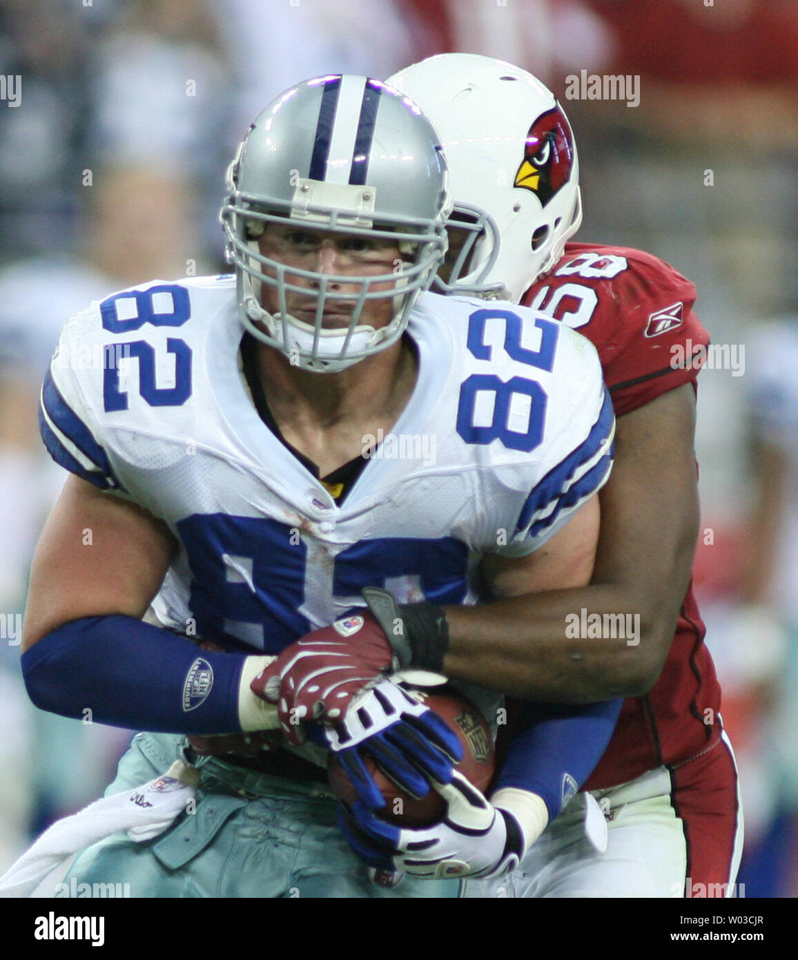 Dallas Cowboys quarterback Tony Romo looks back at the Arizona Cardinals  celebration after blocking a Cowboys punt in overtime for a touchdown to  defeat the Cowboys 30-24 at University of Phoenix Stadium