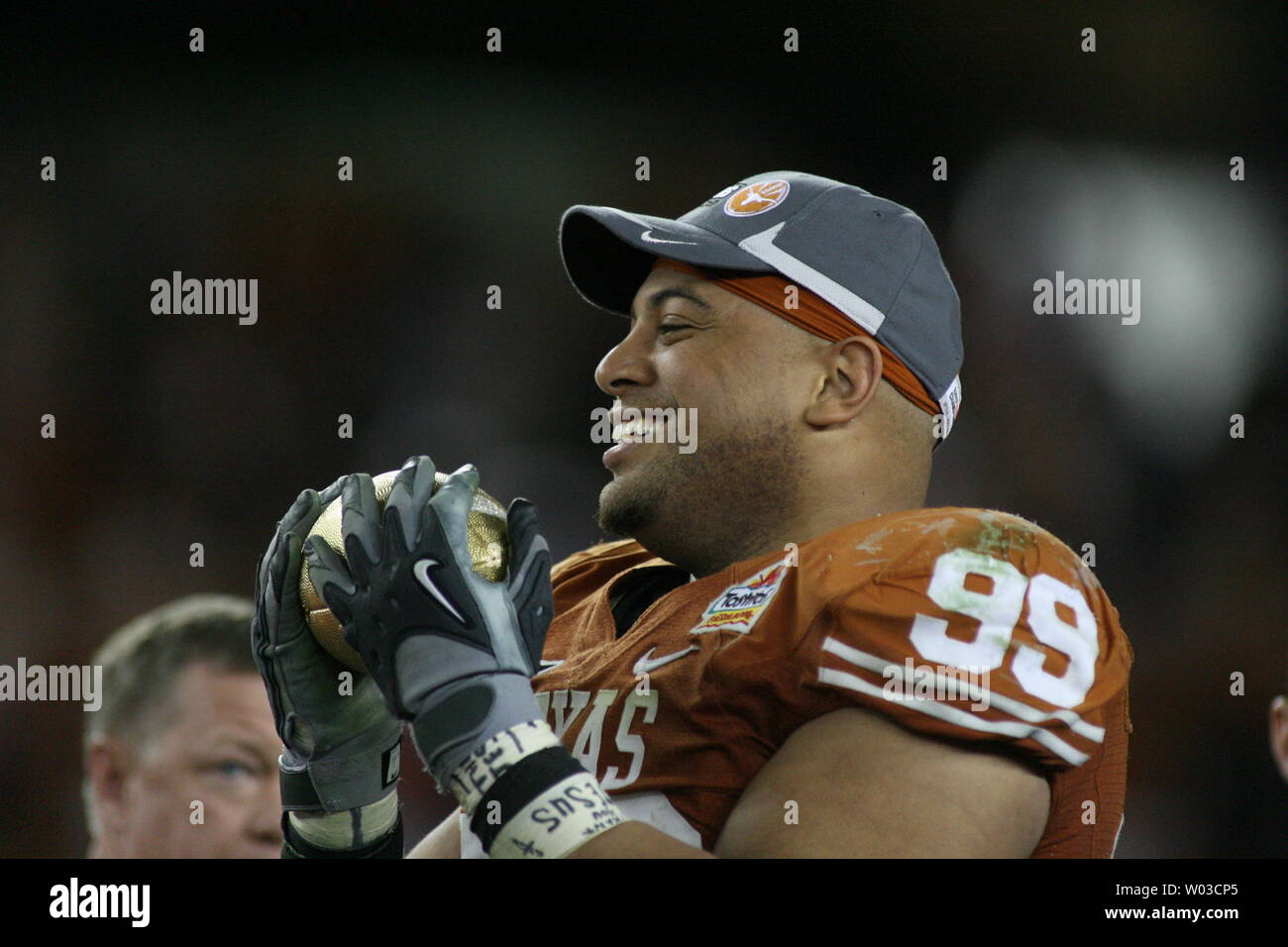 Texas defensive tackle Roy Miller holds the Fiesta Bowl Trophy after Texas defeated Ohio State 24-21 in the Fiesta Bowl at University of Phoenix Stadium in Glendale, Arizona, January 5, 2009. (UPI Photo/Art Foxall) Stock Photo
