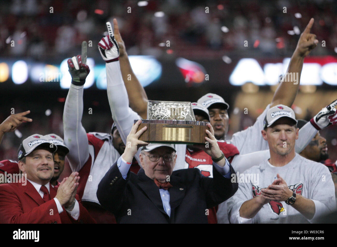 Arizona Cardinals president Michael Bidwill holds the George Halas Trophy  aloft after defeating the Philadelphia Eagles in the NFC Championship game  at University of Phoenix Stadium in Glendale, Arizona, January 18, 2009.