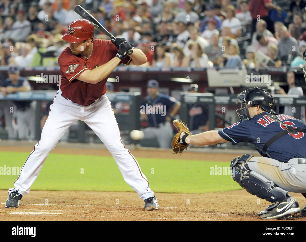 Arizona Diamondbacks starting pitcher Zach Duke (L) can't pull the trigger and takes a called third strike in the third inning against the Cleveland Indians at Chase Field in Phoenix, AZ, June 29,2011.  Catching for the Indians is Lou Marson (R).  UPI/Art Foxall Stock Photo