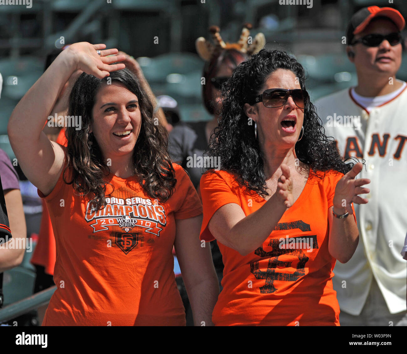 San Francisco Giants fans try to get the attention of players