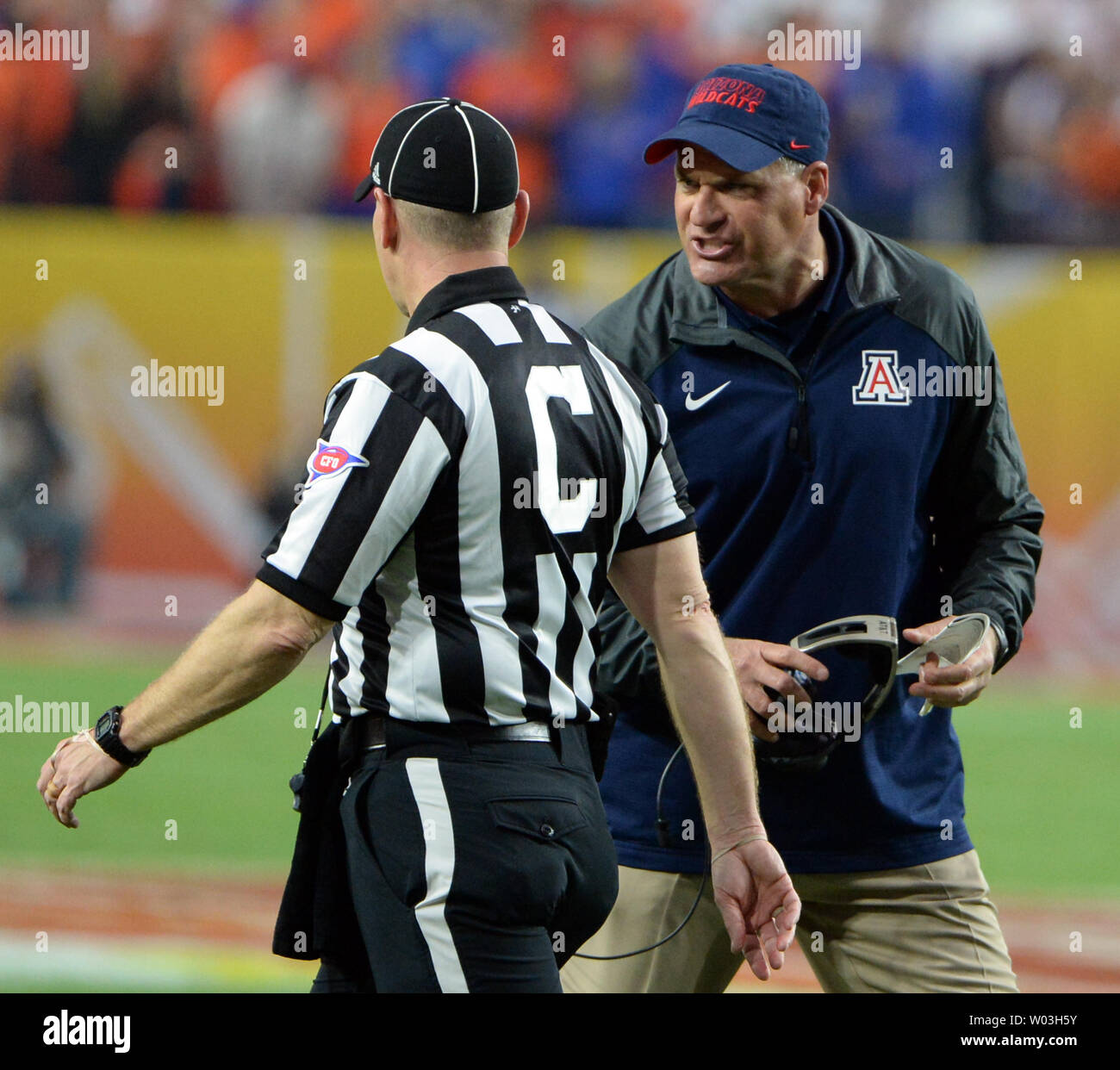 Arizona Wildcats head coach Rich Rodriguez (R) gives an official his opinion in the second quarter of the Fiesta Bowl game between the Wildcats and the Boise State Broncos at University of Phoenix Stadium in Glendale,  Arizona December 31, 2014.  UPI/Art Foxall Stock Photo