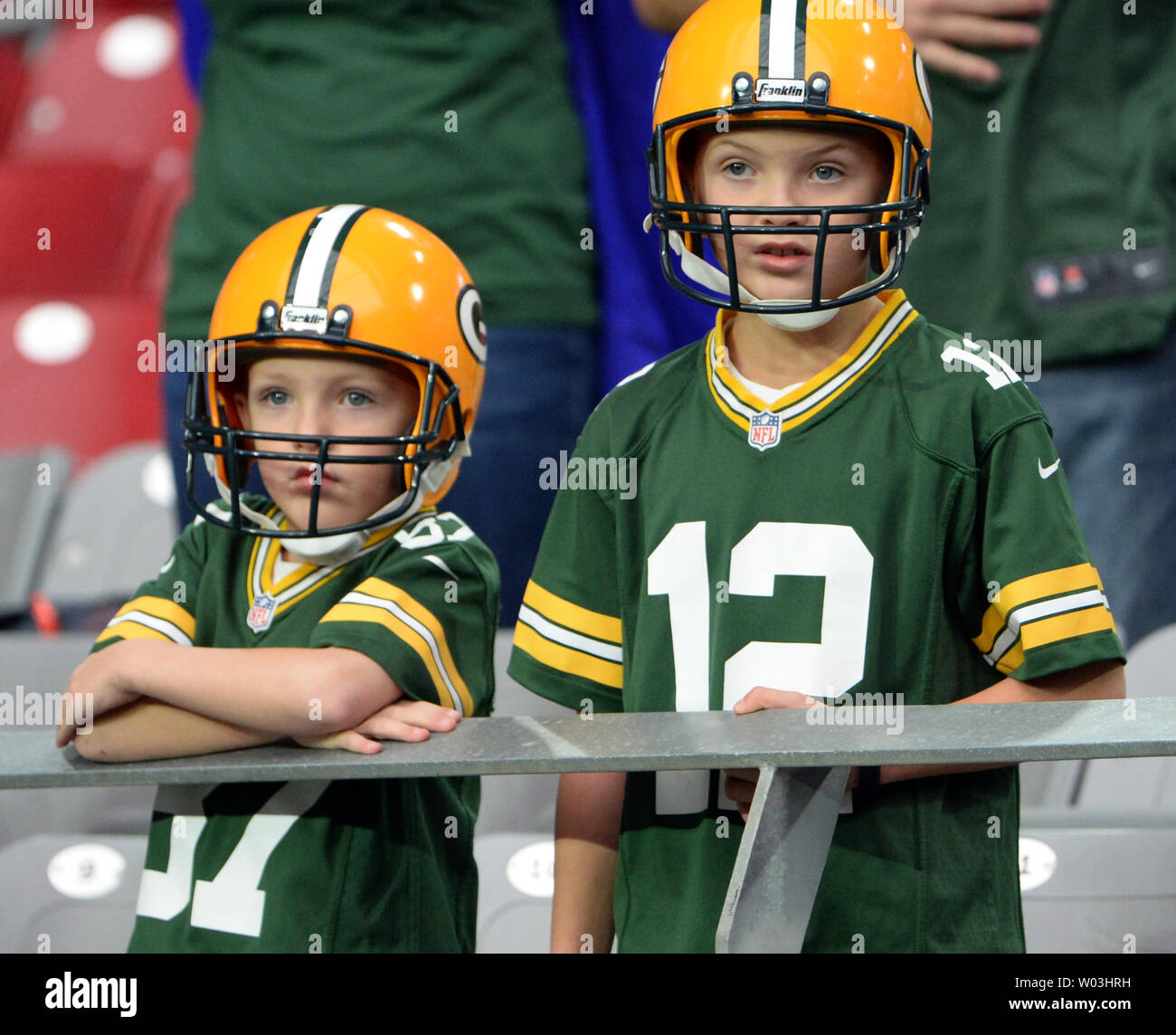 Two young Green Bay Packers fans watch the Packers warm up before the Packers-Arizona Cardinals game at University of Phoenix Stadium in Glendale, Arizona, December 27, 2015. Photo by Art Foxall/UPI Stock Photo