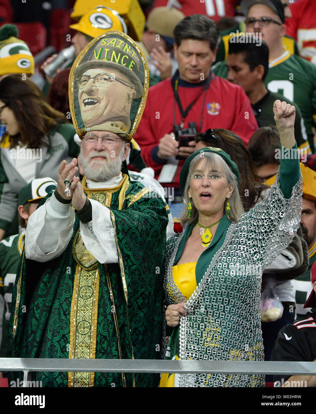 Two Green Bay Packers fans applauded their team in the first half of the Packers-Arizona Cardinals game at University of Phoenix Stadium in Glendale, Arizona, December 27, 2015. Photo by Art Foxall/UPI Stock Photo