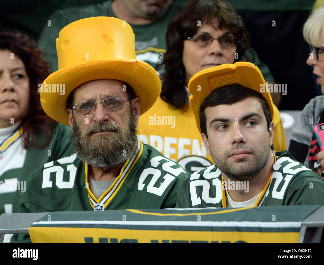 Two Green Bay Packers fans wear different style cheese head hats during the first half of the Packers-Arizona Cardinals game at University of Phoenix Stadium in Glendale, Arizona, December 27, 2015. Photo by Art Foxall/UPI Stock Photo
