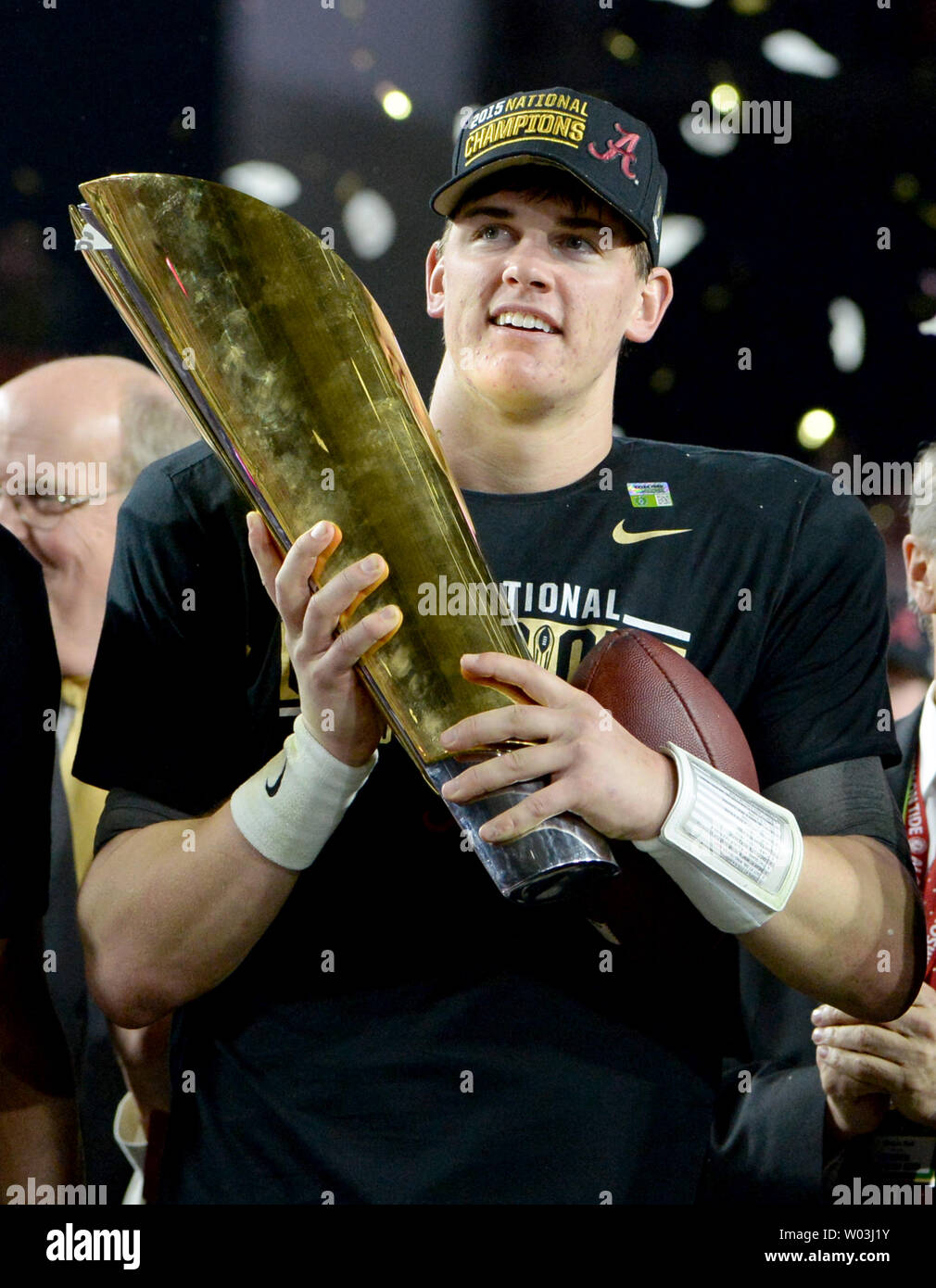 Alabama Crimson Tide quarterback Jake Coker holds up the holds up the