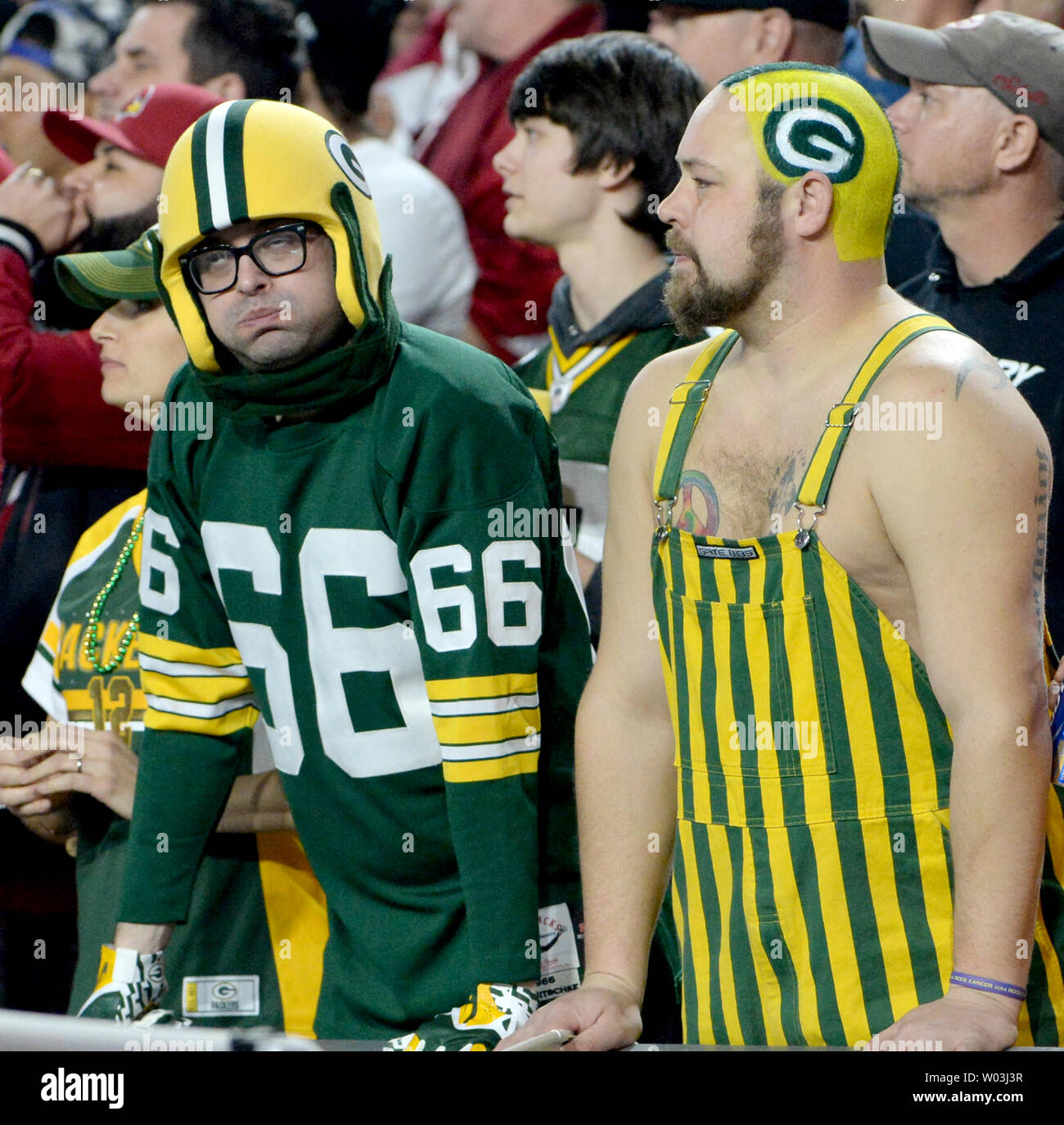 Two Green Bay Packers fans react to play on the field in the first quarter of the Packers-Arizona Cardinals game at University of Phoenix Stadium in Glendale, Arizona on January 16, 2016. Photo by Art Foxall/UPI Stock Photo