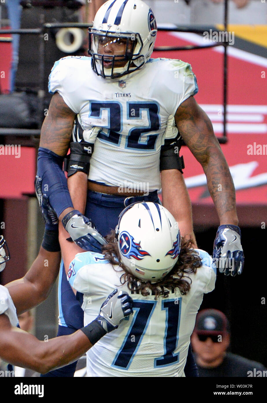 Tennessee Titans' Derrick Henry (22) is lifted up by teammate Dennis Kelly after Henry scored a touchdown in the second quarter against the Arizona Cardinals at University of Phoenix Stadium in Glendale, Arizona December 10, 2017. Photo by Art Foxall/UPI Stock Photo