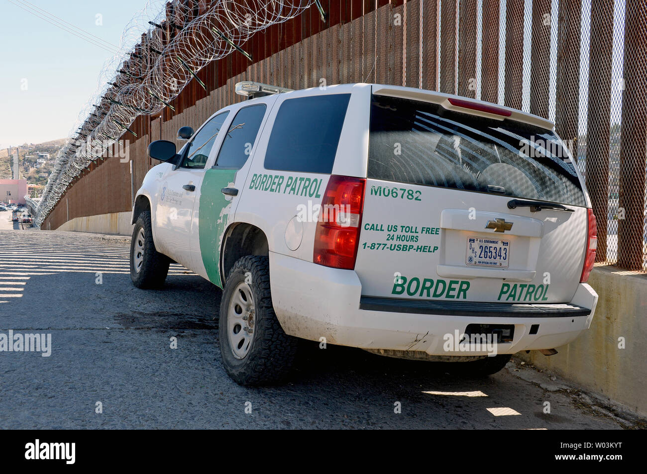 https://c8.alamy.com/comp/W03KYT/a-united-states-border-patrol-truck-sits-in-the-shadow-of-the-border-fence-which-is-adorned-with-barbed-wire-on-its-top-in-nogales-arizona-february-8-2019-the-arizona-city-has-ordered-federal-officials-to-remove-the-razor-wire-was-placed-at-the-top-and-bottom-of-the-fence-photo-by-art-foxallupi-W03KYT.jpg