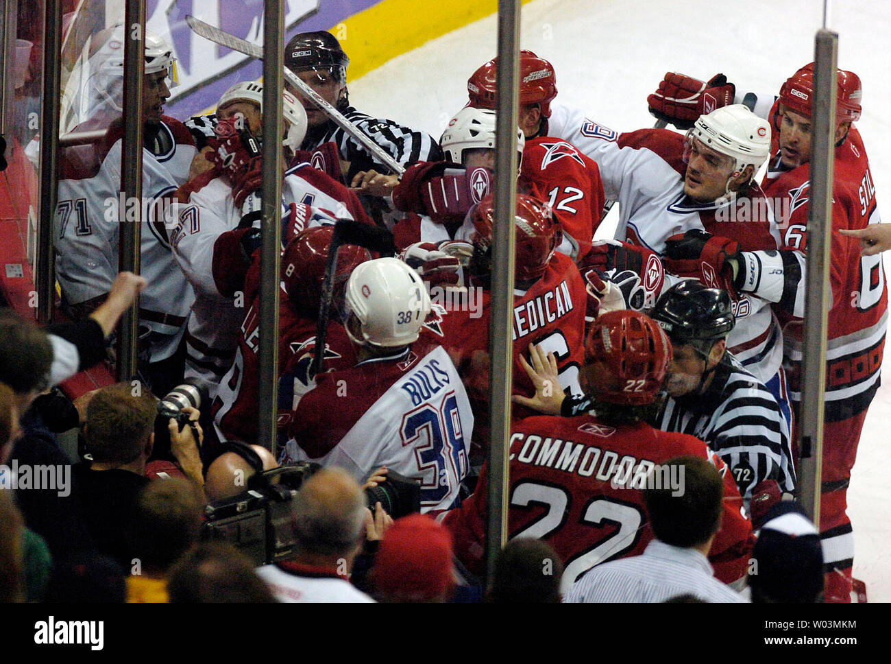 Members of the Montreal Canadiens and Carolina Hurricanes fight in a corner on the ice as the officials try to break up the crowd in the first period of Game 2 of the NHL Eastern Conference quaterfinals at the RBC Center in Raleigh, NC April 24, 2006.  (UPI Photo/Jeffrey A. Camarati) Stock Photo
