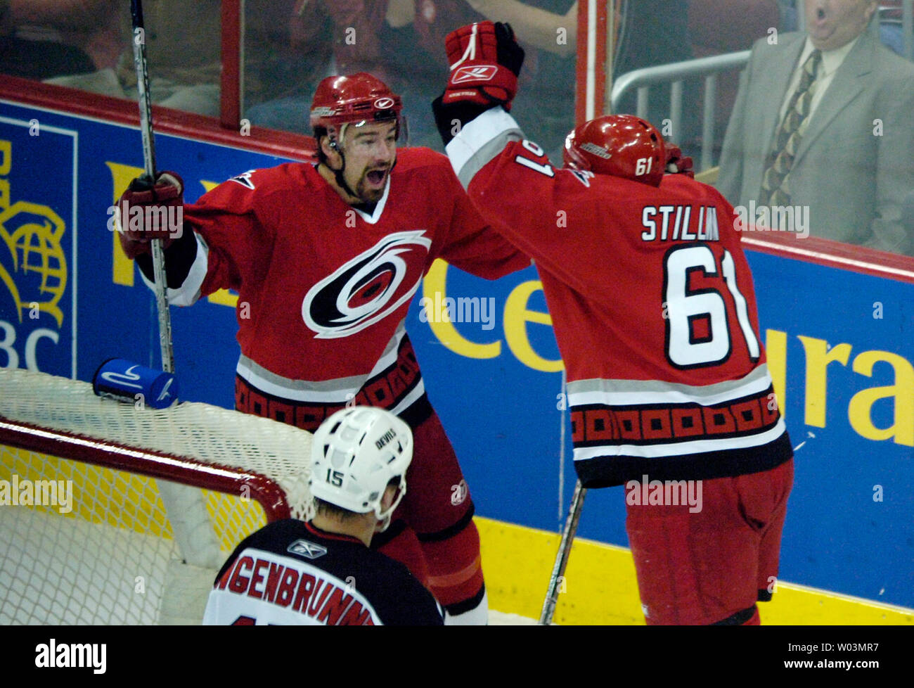 Carolina Hurricanes' Justin Williams, left, skates toward teammate Cory Stillman after Stillman scored against the New Jersey Devils during Game 5 of the NHL Eastern Conference semifinals at the RBC Center in Raleigh, NC May 14, 2006.  Williams was credited with the assist on the goal.  Watching the celebration is New Jersey Devils' Jamie Langenbrunner, bottom.  (UPI Photo/Jeffrey A. Camarati) Stock Photo