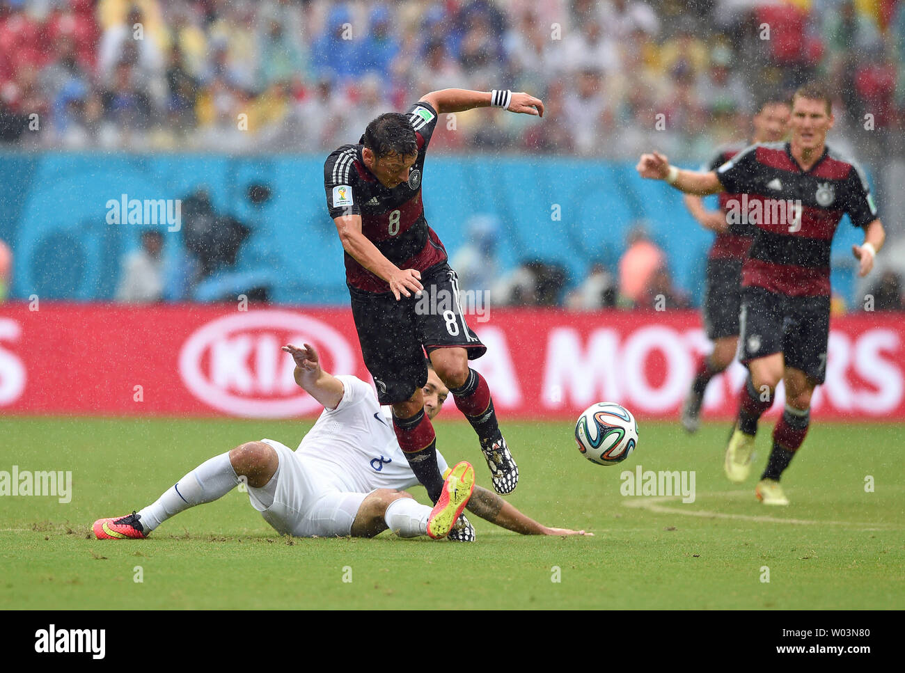 Clint Dempsey (L) of USA challenges Mesut Ozil of Germany during the 2014 FIFA World Cup Group G match at the Arena Pernambuco in Recife, Brazil on June 26, 2014. UPI/Chris Brunskill Stock Photo