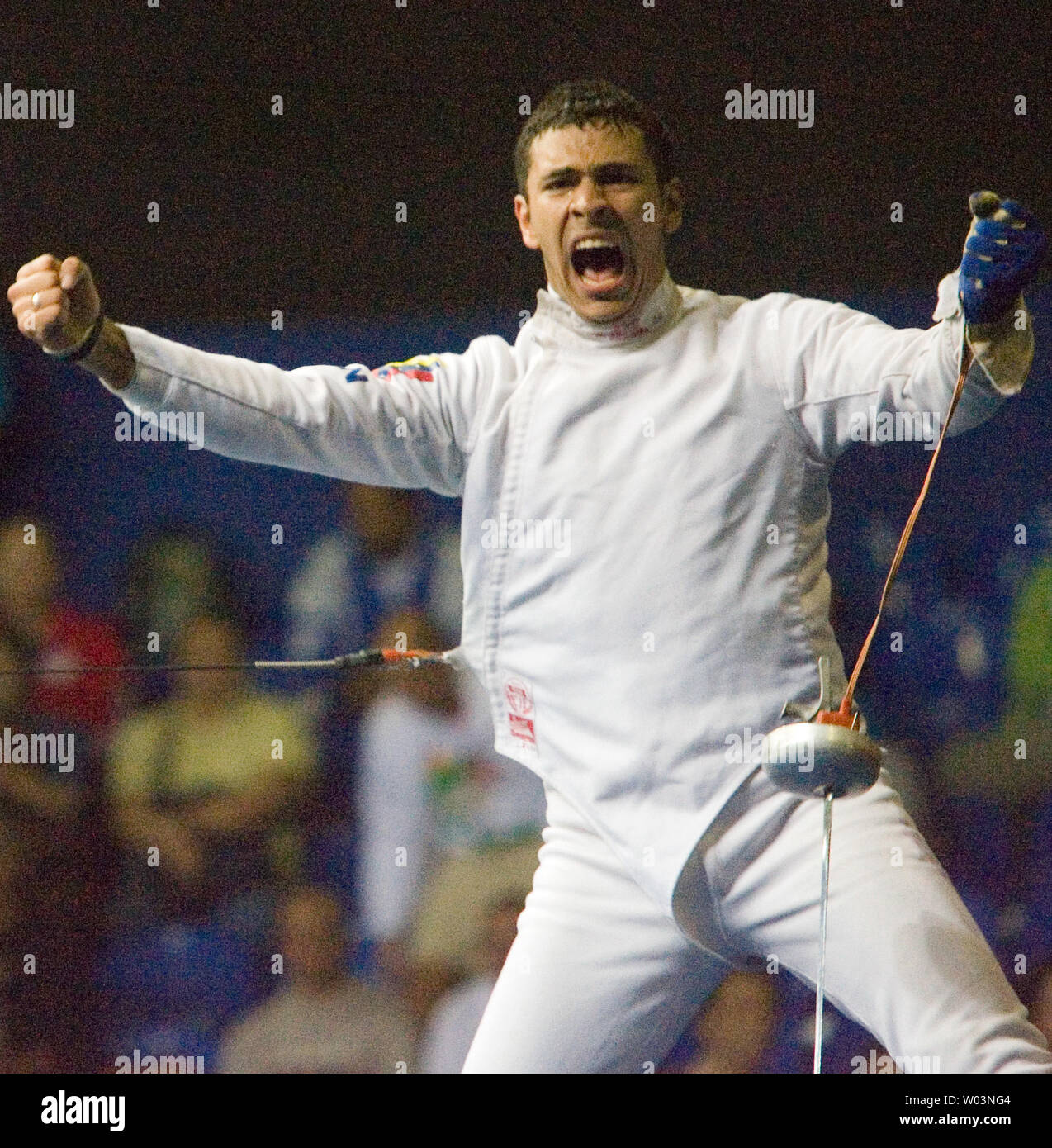 Venezuela's Reuben Limardo celebrates after beating Cuba's Andres Carrillo 11-10 in overtime, winning gold in men's individual epee at Riocentro during the 2007 Pan Am Games in Rio de Janeiro, Brazil on July 16, 2007.   (UPI Photo/Heinz Ruckemann) Stock Photo