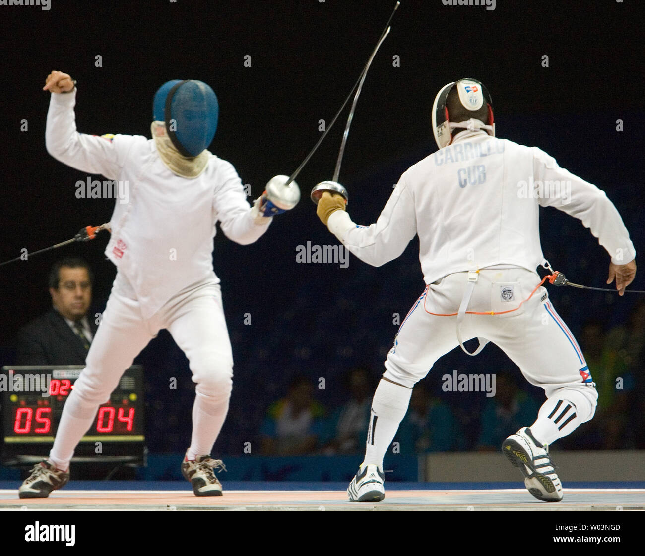 Venezuela's Reuben Limardo (L) locks blades with Cuba's Andres Carrillo in the gold medal match of men's individual epee at Riocentro during the 2007 Pan Am Games in Rio de Janeiro, Brazil on July 16, 2007. Limardo went on to win gold, beating Carrillo 11-10 in overtime.  (UPI Photo/Heinz Ruckemann) Stock Photo