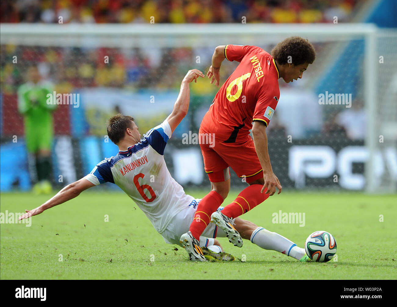 Axel Witsel of Belgium is challenged by Maksim Kanunnikov (L) of Russia during the 2014 FIFA World Cup Group H match at the Estadio do Maracana in Rio de Janeiro, Brazil on June 22, 2014. UPI/Chris Brunskill Stock Photo