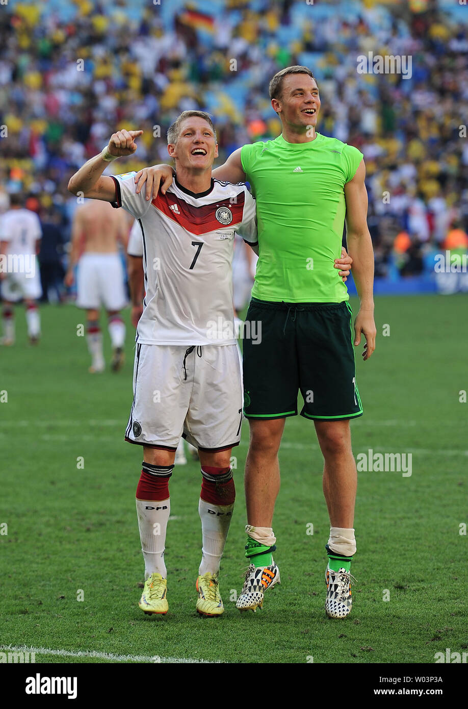 Bastian Schweinsteiger (L) and Manuel Neuer of Germany celebrate following the 2014 FIFA World Cup Quarter Final match at the Estadio do Maracana in Rio de Janeiro, Brazil on July 04, 2014. UPI/Chris Brunskill Stock Photo