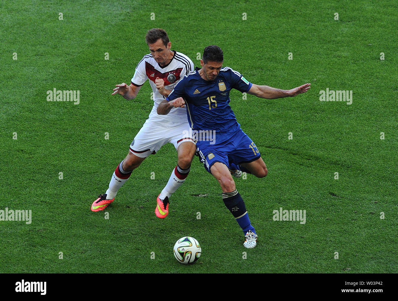 Miroslav Klose (L) of Germany competes with Martin Demichelis of Argentina during the 2014 FIFA World Cup Final at the Estadio do Maracana in Rio de Janeiro, Brazil on July 13, 2014. UPI/Chris Brunskill Stock Photo
