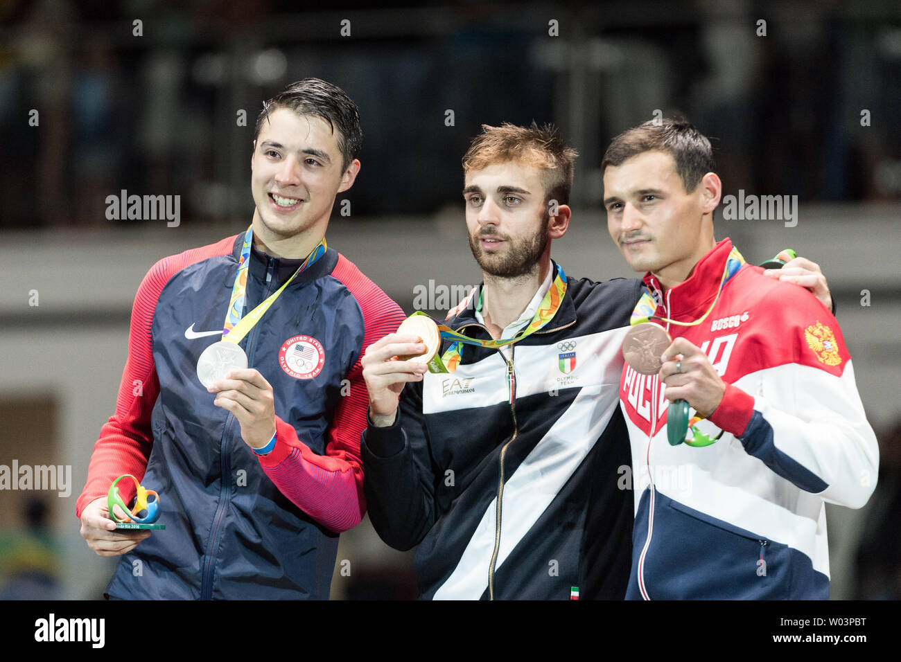 Gold Medal Winner Daniele Garozzo Center Of Italy Stands With Silver Medalist Alexander Massialas Of The United States Left And Bronze Medalist Timur Safin Of The Russian Federation During The Medal Ceremony