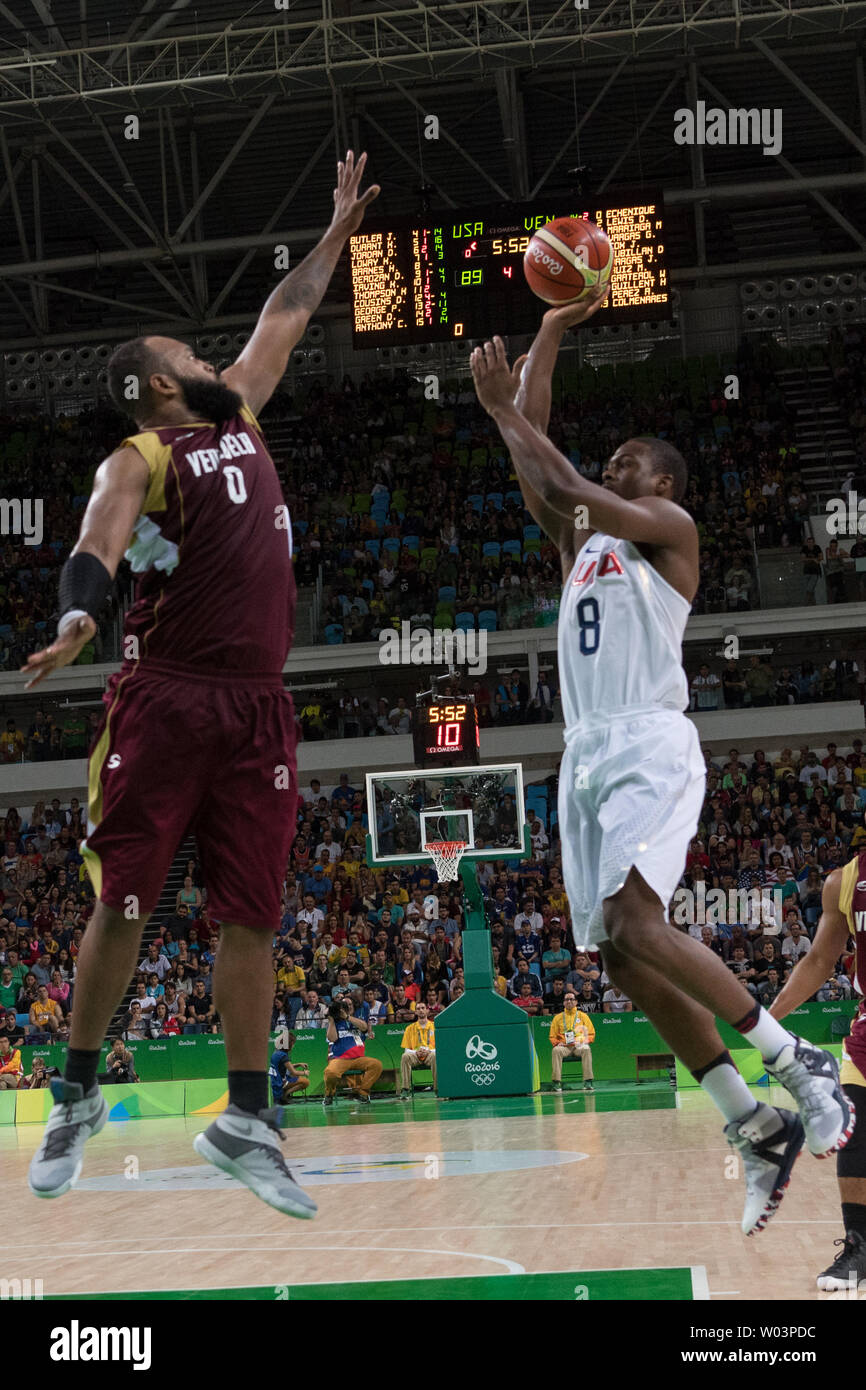 United States forward Harrison Barnes (8) goes for the jump shot against  Venezuela center Gregory Echenique (0) during basketball competition during  the Rio Olympic Games at the Carioca Arena 1 in Rio