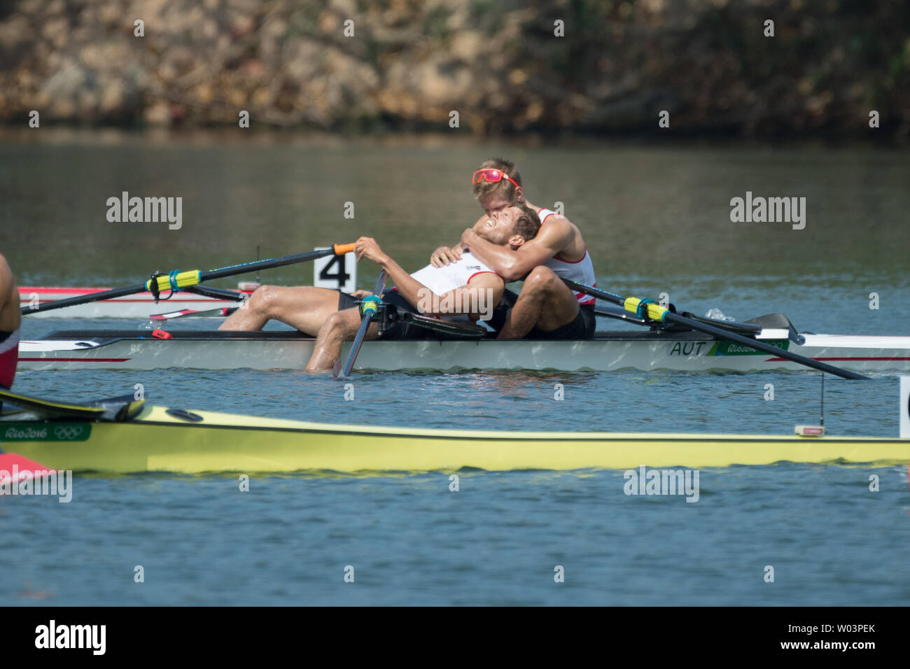Mads Rasmussen and Rasmus Quist, of Denmark, embrace after winning the