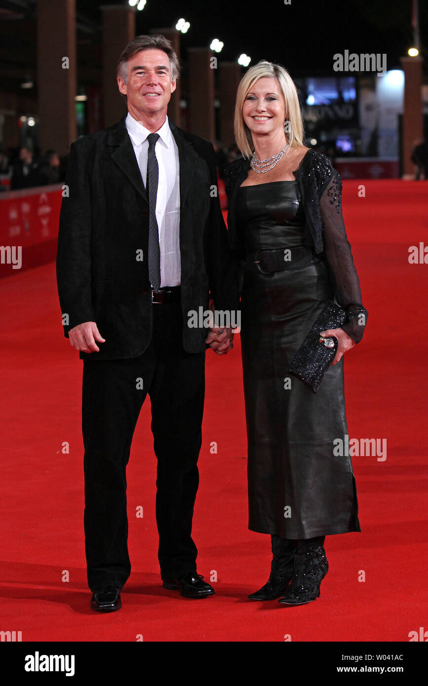 Olivia Newton-John and her husband John Easterling arrive on the red carpet before a screening of the film 'A Few Best Men' during the 6th Rome International Film Festival in Rome on October 28, 2011.   UPI/David Silpa Stock Photo