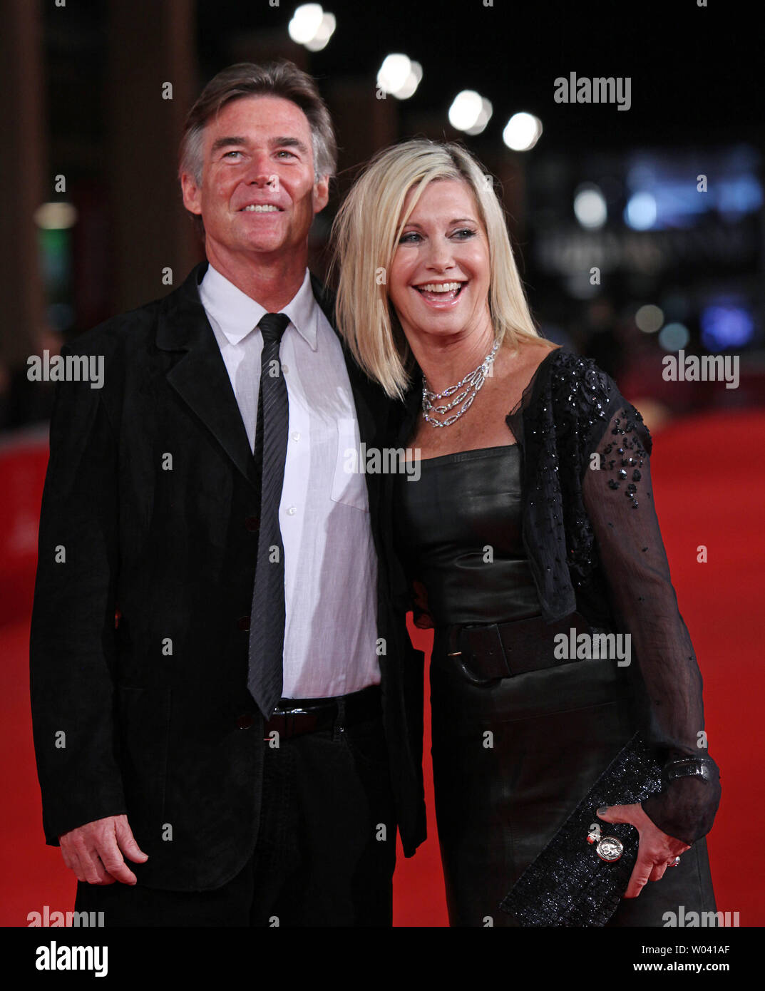 Olivia Newton-John and her husband John Easterling arrive on the red carpet before a screening of the film 'A Few Best Men' during the 6th Rome International Film Festival in Rome on October 28, 2011.   UPI/David Silpa Stock Photo
