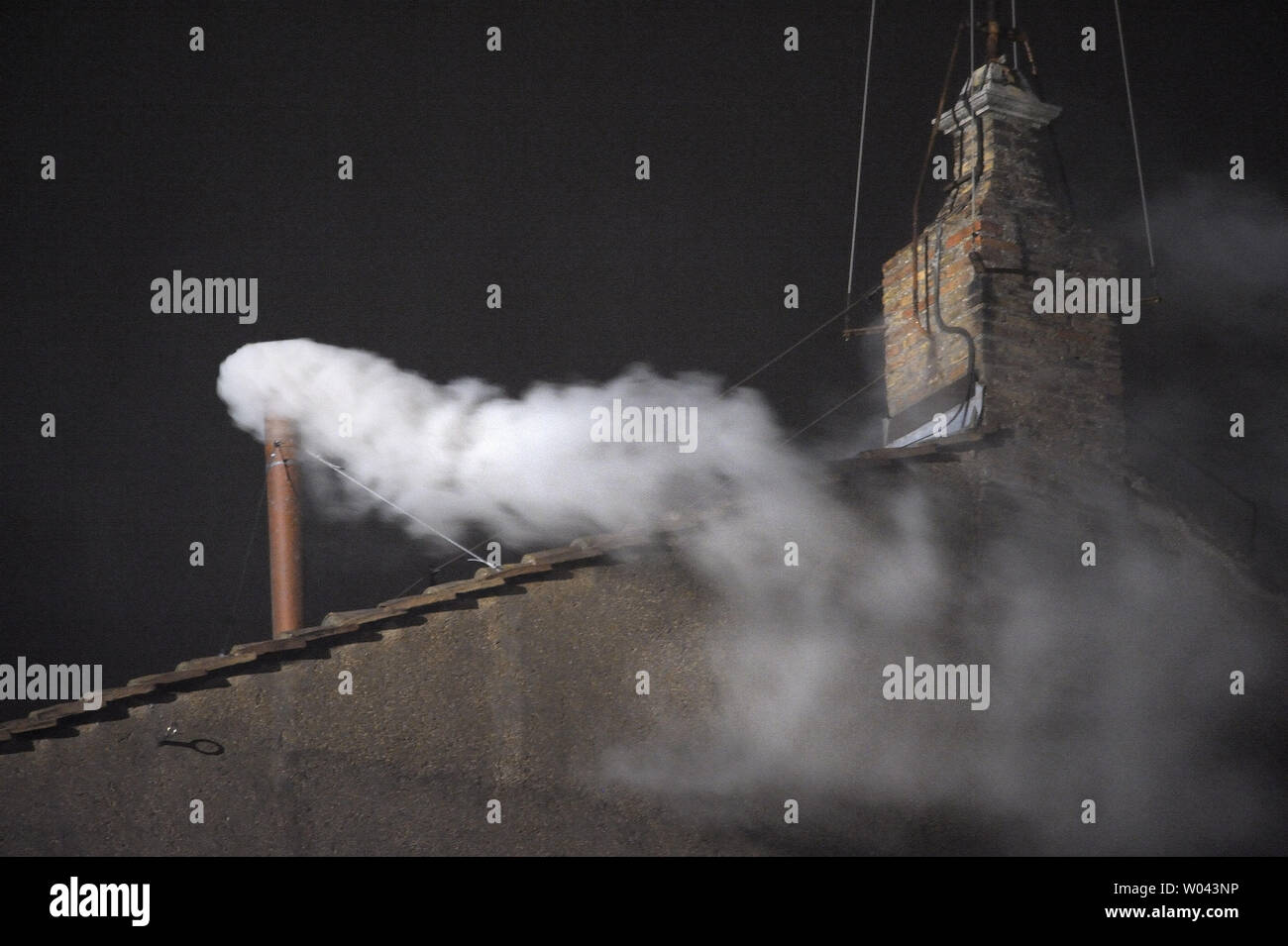 White smoke billows from the chimney of the sistine chapel meaning that