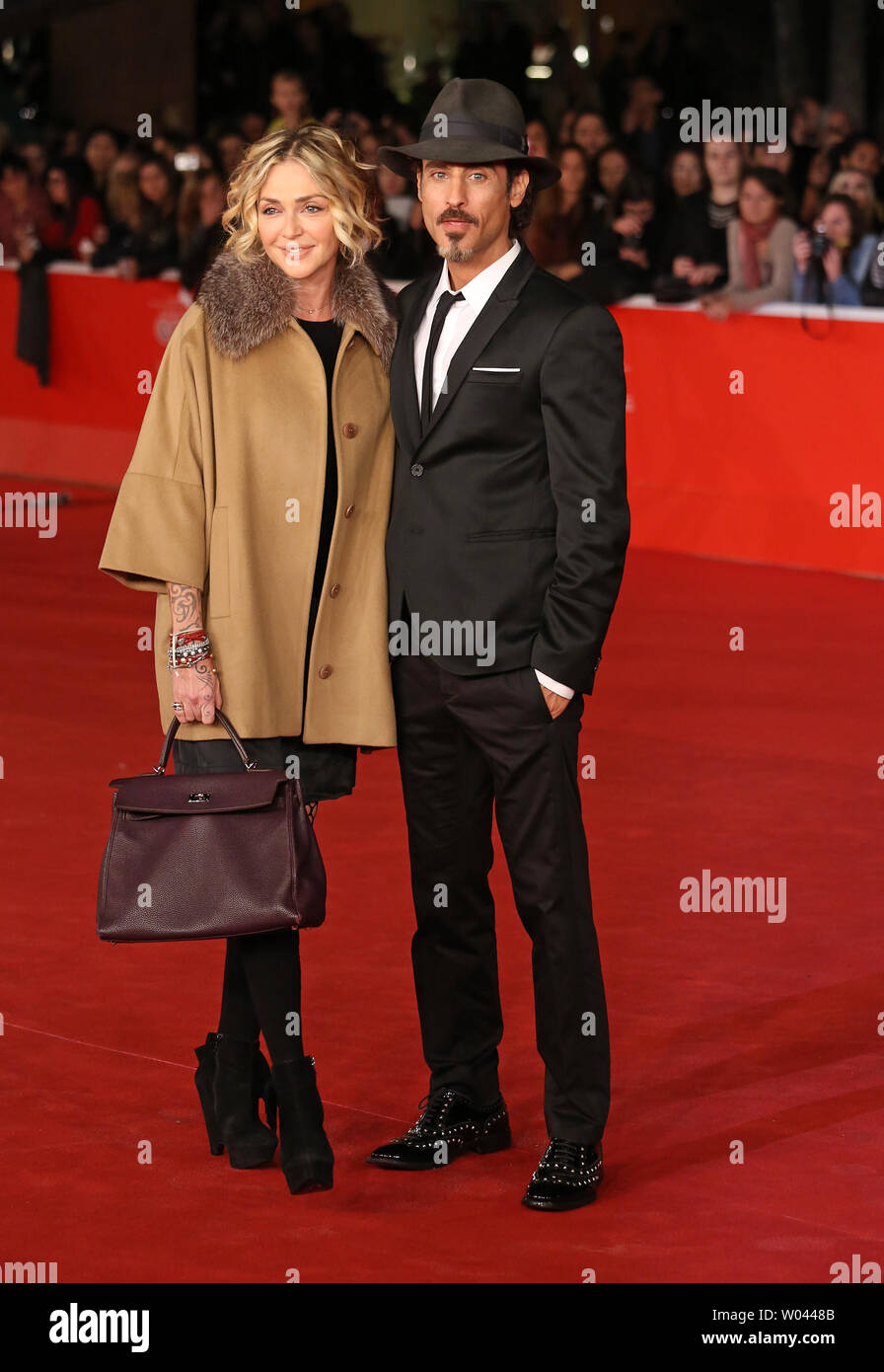 Paola Barale (L) and Raz Degan arrive on the red carpet before the screening of the film 'Dallas Buyers Club' during the 8th annual Rome International Film Festival in Rome on November 9, 2013.   UPI/David Silpa Stock Photo
