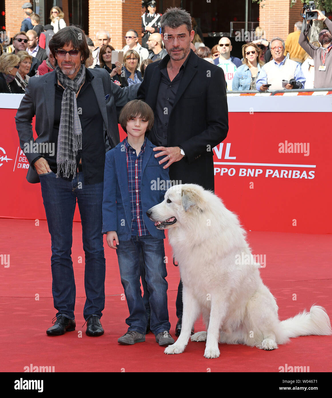 Christian Duguay (L), Felix Bossuet (C) and Thierry Neuvic arrive on the red carpet before the screening of the film 'Belle et Sebastien, l'aventure continue' at the 10th annual Rome International Film Festival in Rome on October 17, 2015.   UPI/David Silpa Stock Photo