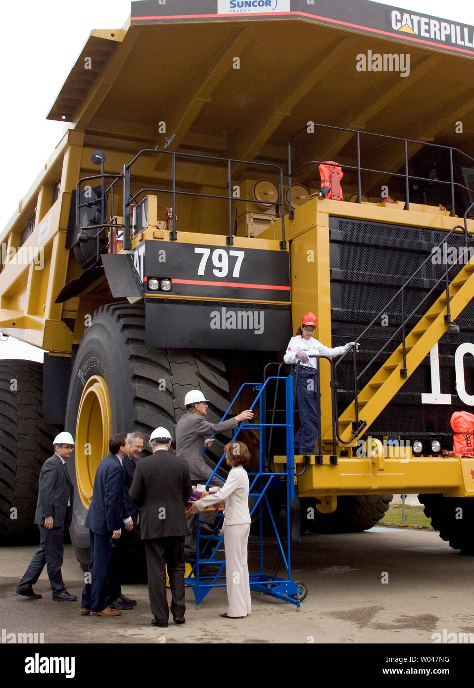 Oil sands heavy hauler driver 29yearold Tracy Gladue (red hat) guides