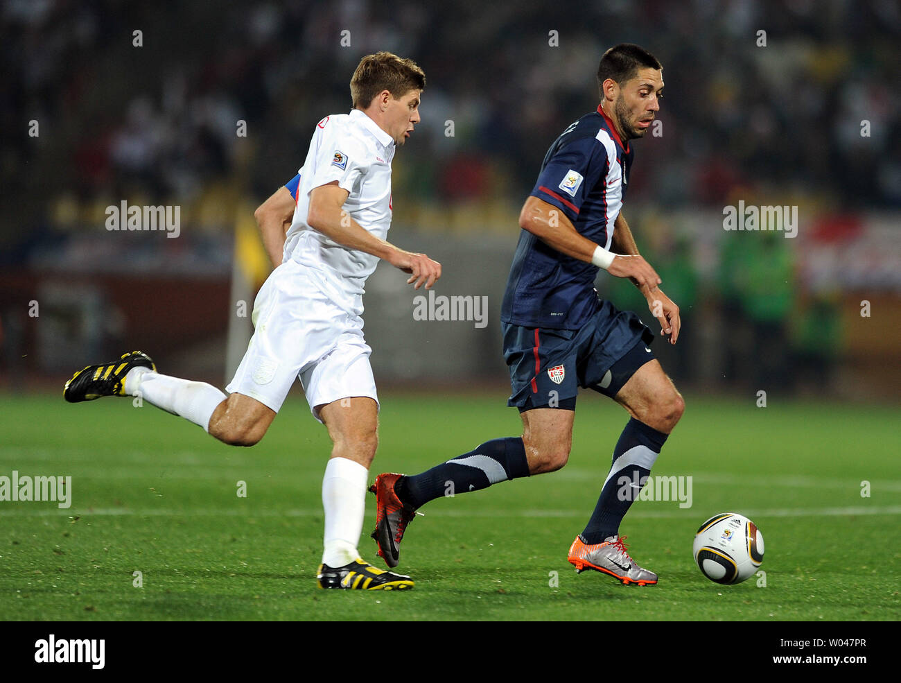 Steven Gerrard of England battles with Clint Dempsey of USA during the Group B match at the Royal Bafokeng Stadium in Rustenburg, South Africa on June 12, 2010. UPI/Chris Brunskill Stock Photo