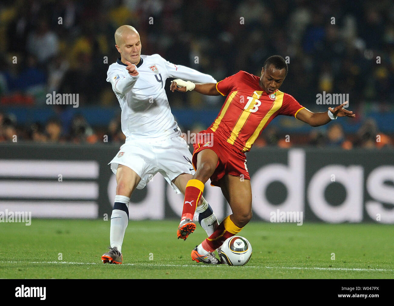 Michael Bradley of USA and Andre Ayew of Ghana go after the ball during the Round of 16 match at the Royal Bafokeng Stadium in Rustenburg, South Africa on June 26, 2010. UPI/Chris Brunskill Stock Photo