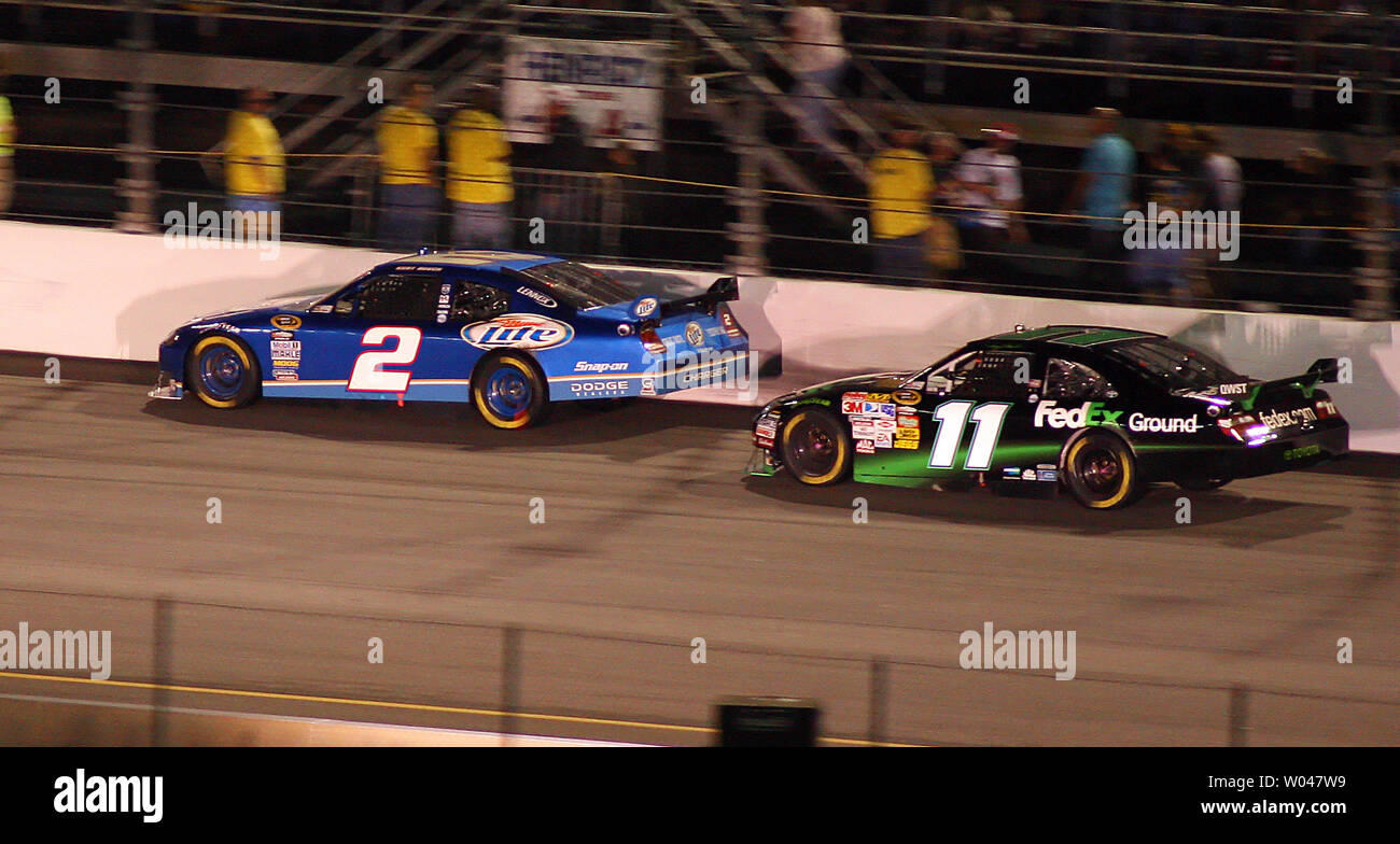 Kyle Busch 2 Drives His Car Around The Outside Of Denny Hamlin 11 To Take The Lead During The Running Of The Nascar Crown Royal Presents The Russ Friedman 400 At Richmond
